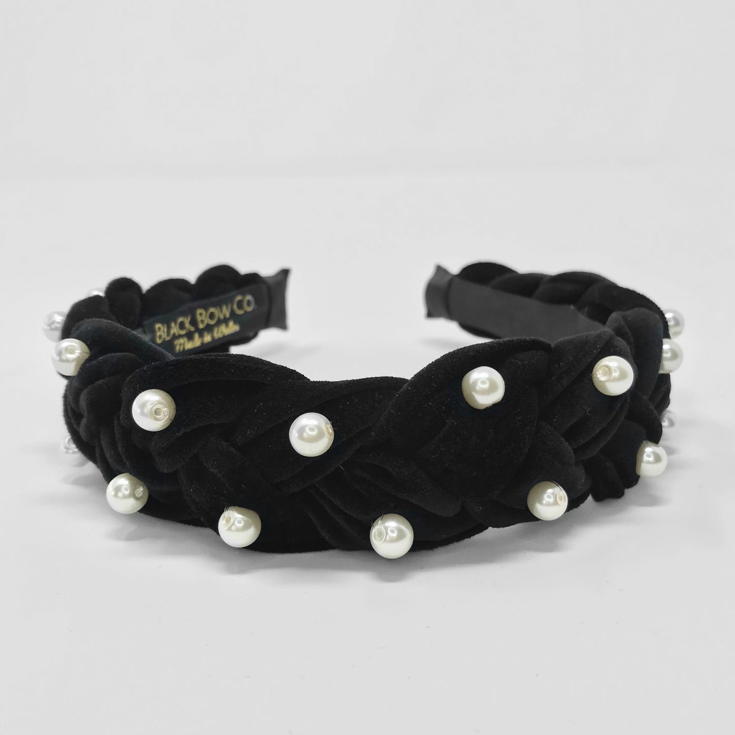 a black velvet headband and pearl headband